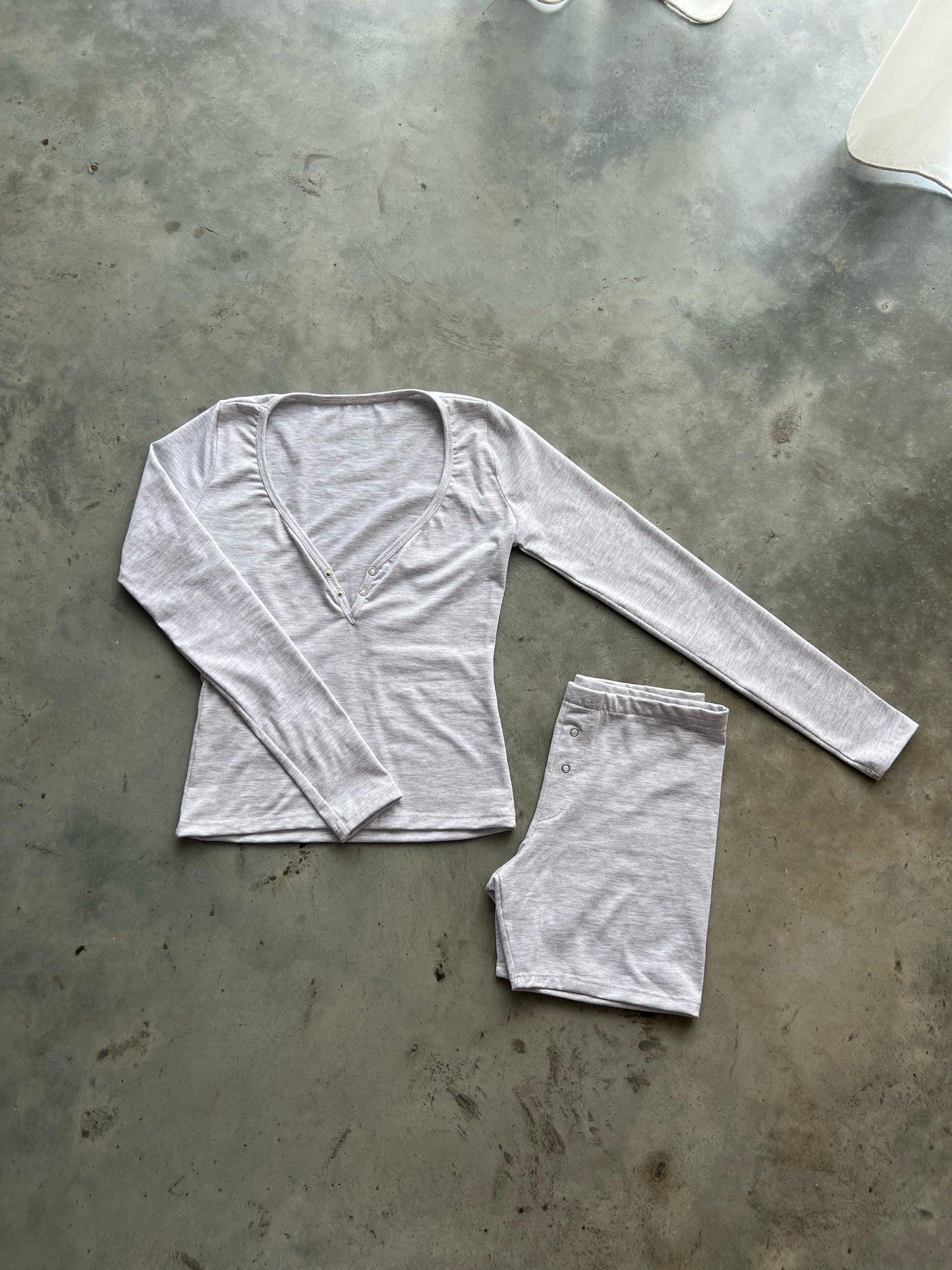 Light gray V neck top with buttons