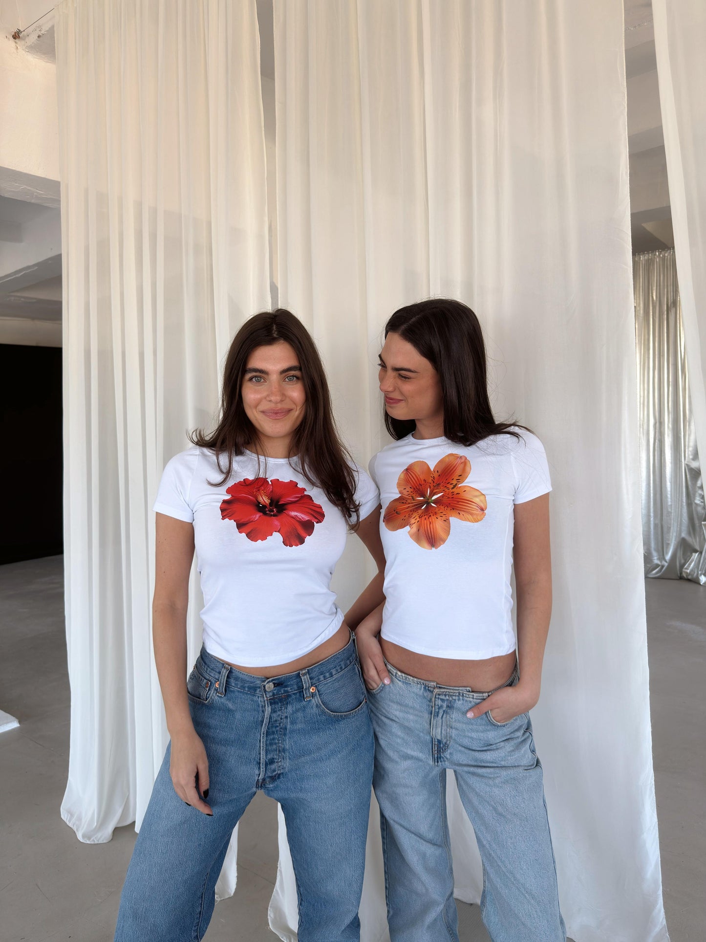 White top with orange flower