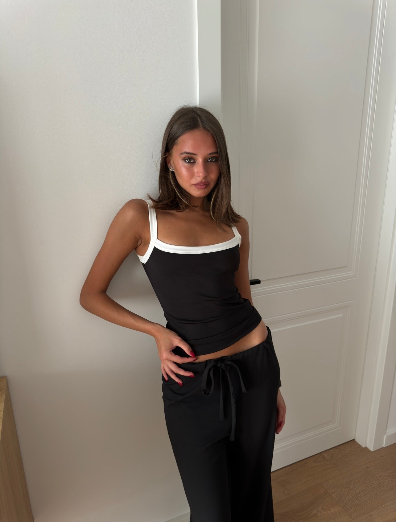 Black bralette top with white line