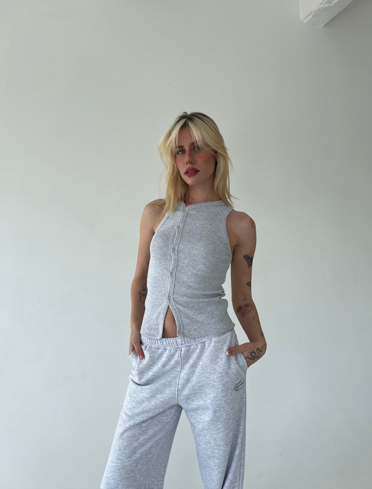 Light gray tank top with buttons