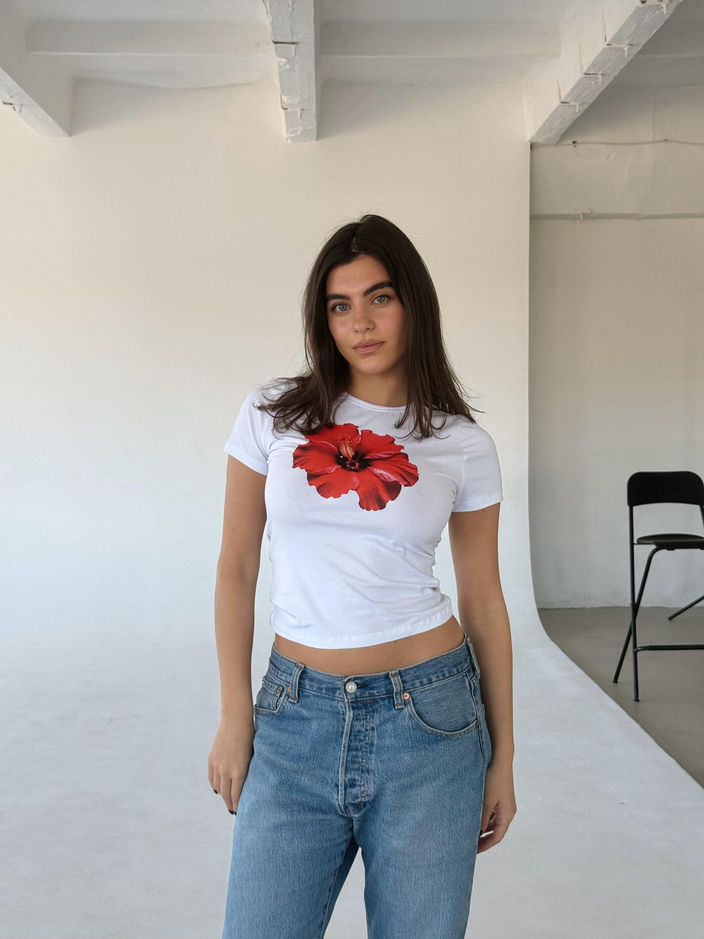 White top with red flower