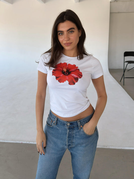 White top with red flower