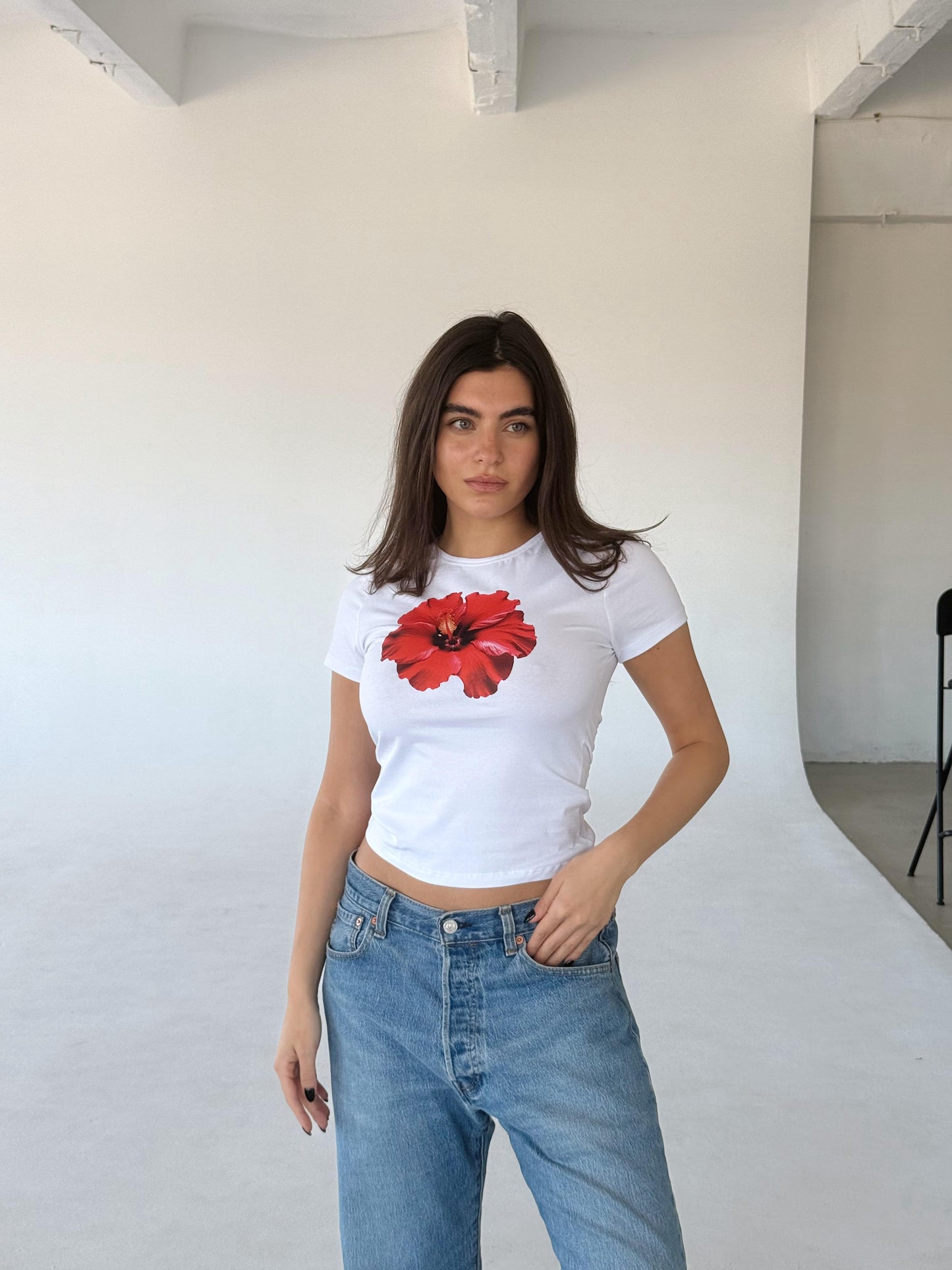 White top with red flower