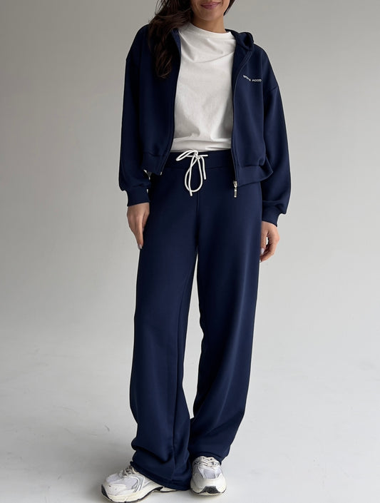 Navy blue straight sweatpants with ribbed-knit waist