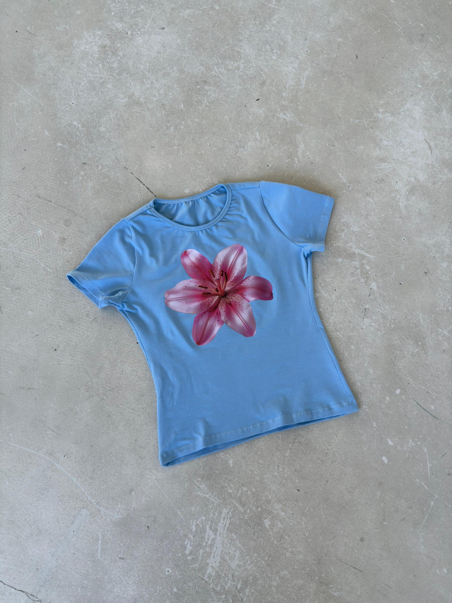 Baby blue top with pink flower